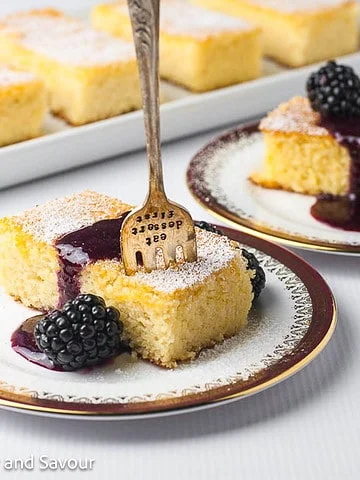 Flourless Lemon Ricotta Cake with blackberry sauce.