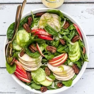 Fennel apple chicken salad in a shallow bowl, overhead view.