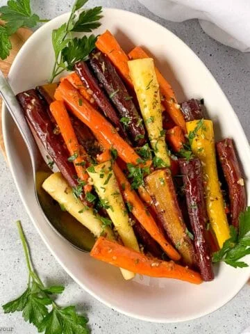 A bowl of roasted rainbow carrots.