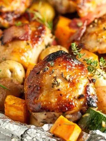 Roasted chicken thighs and vegetables on a sheet pan