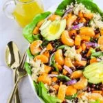 A bowl of Quinoa Salad with oranges and avocado