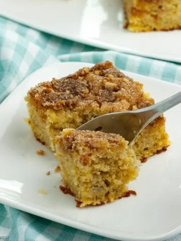 a forkful of Grain Free Banana Coffee Cake on a turquoise cloth