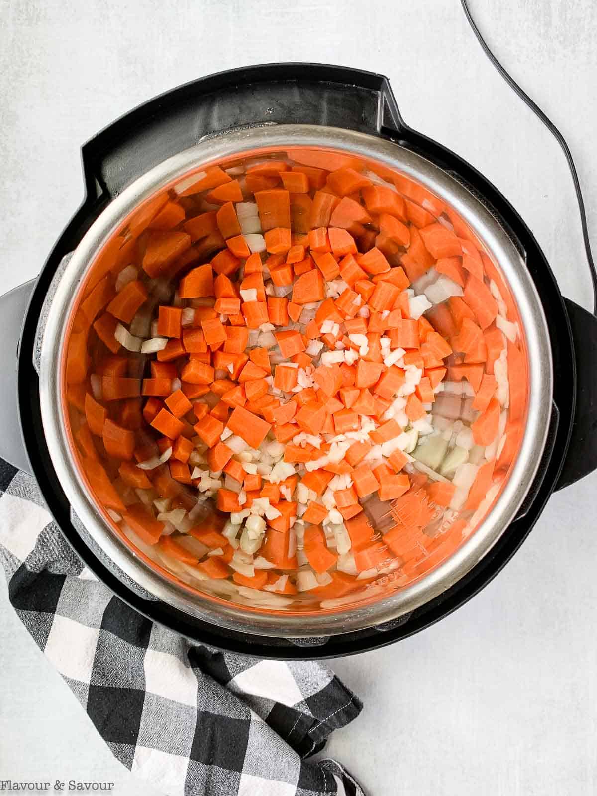 onions and carrots in an instant pot