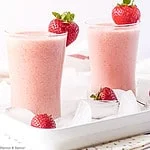 two glasses of strawberry watermelon collagen smoothie