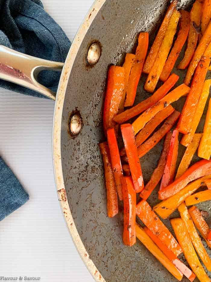 Sautéed peppers in a skillet.