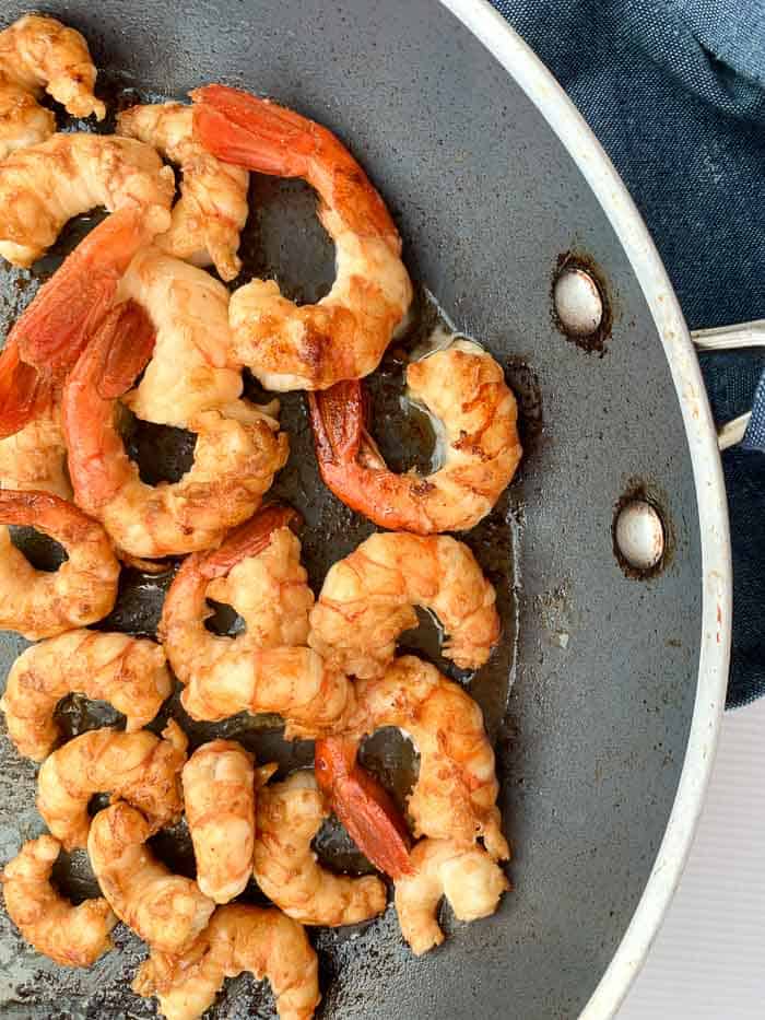 Shrimp or prawns in a skillet.