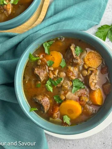 A bowl of lentil and sausage stew.