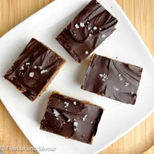 Peanut butter collagen bars on a white plate.