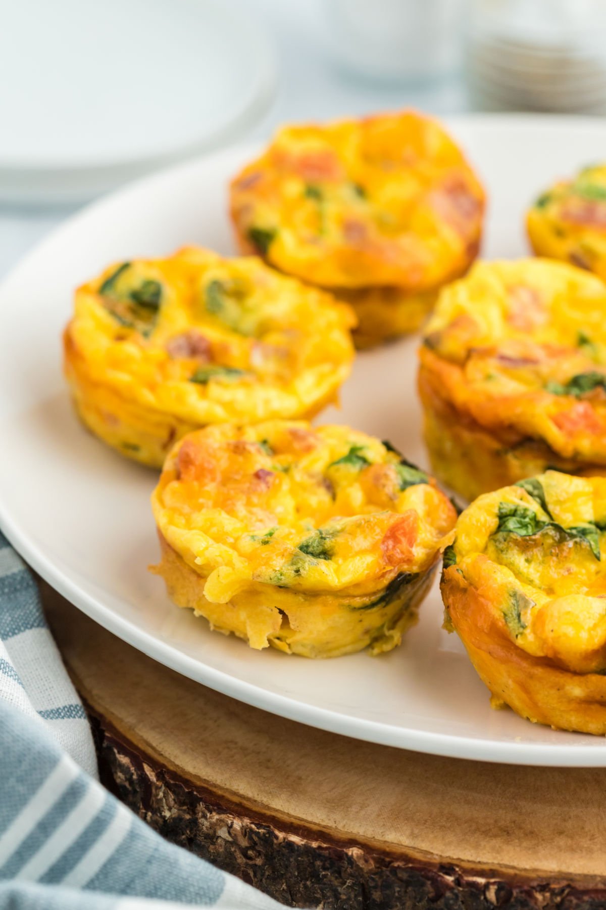 Egg bites on a white serving plate.